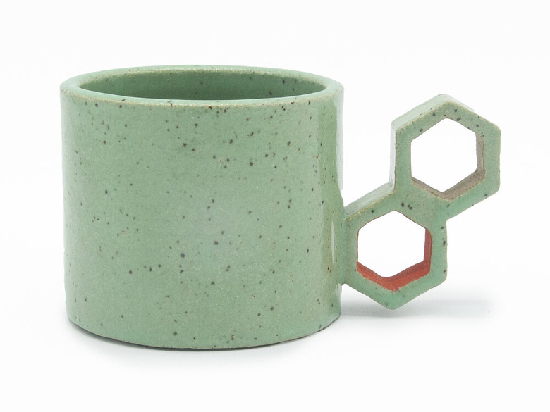 Mint-green ceramic mug with beehive inspired handle by Eunbi