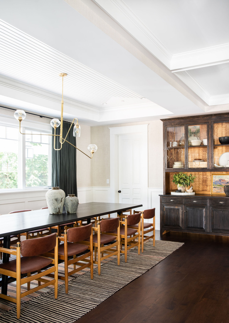 Champagne color painted dining room designed by Amber Interiors