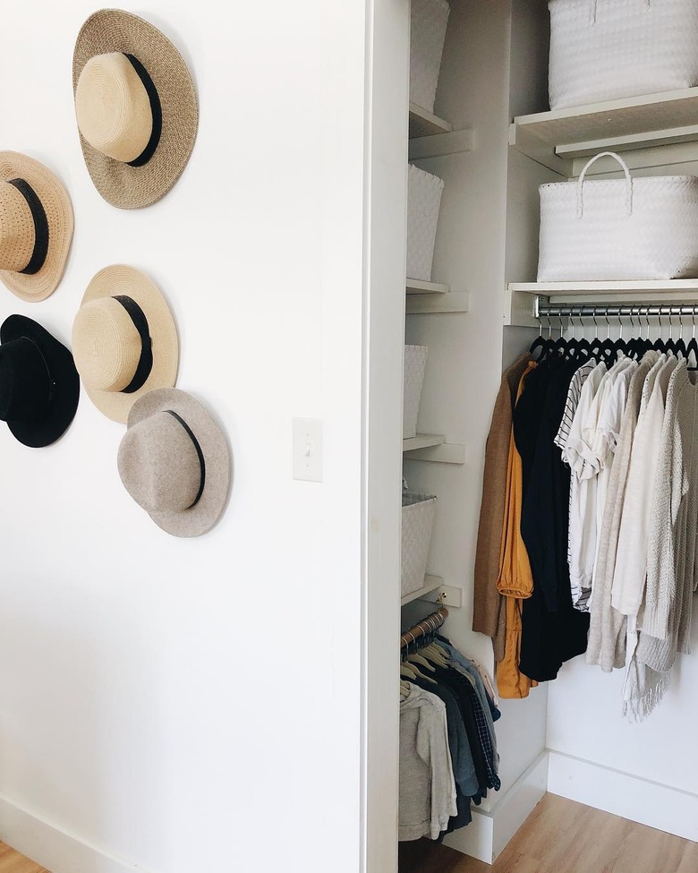 small bedroom organization ideas with hat display