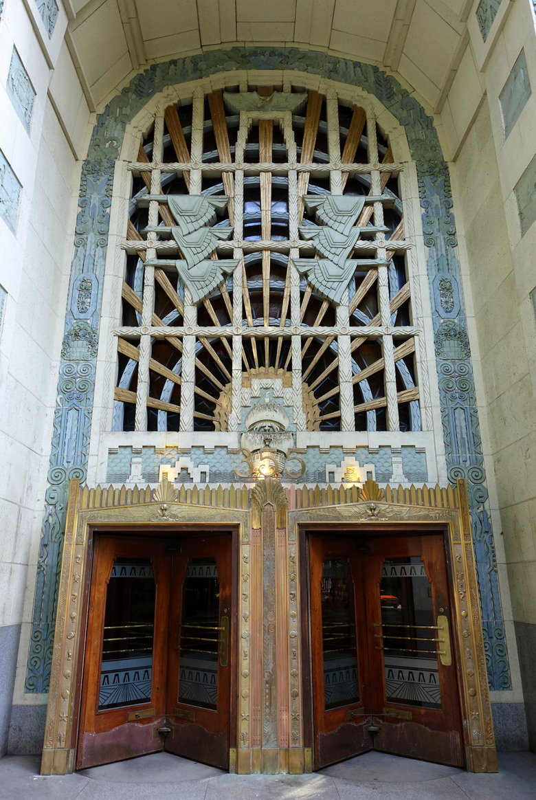 exterior shot of the doors with intricate art deco details in the Marine Building in Canada