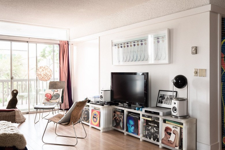 accent chair in living room with a balcony