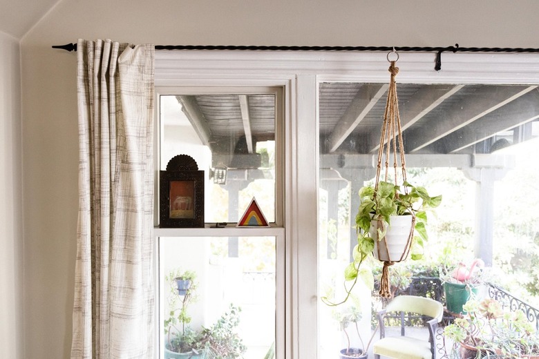 A tan curtain over a glass window