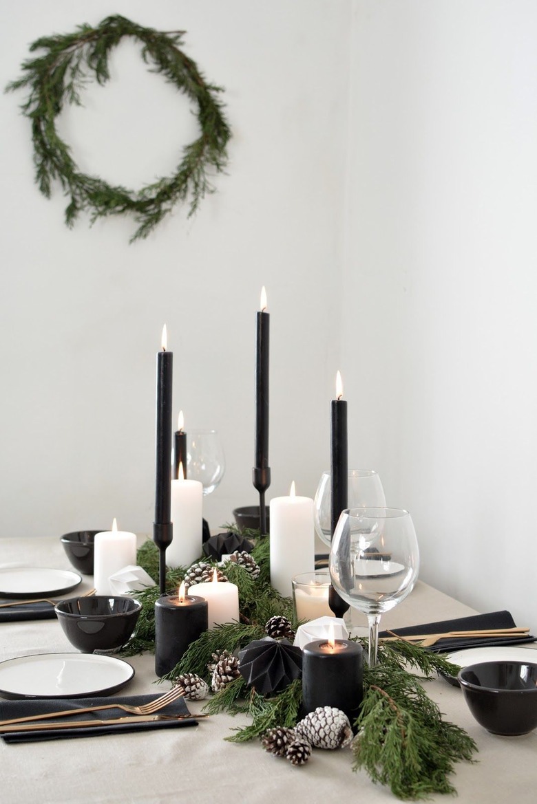 white and black tablescape with black candles for Christmas centerpiece