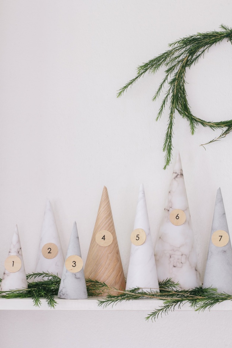 White, gray, beige paper cones with numbers for Christmas decorations list