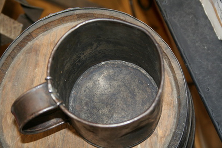 Tarnished tin cup.