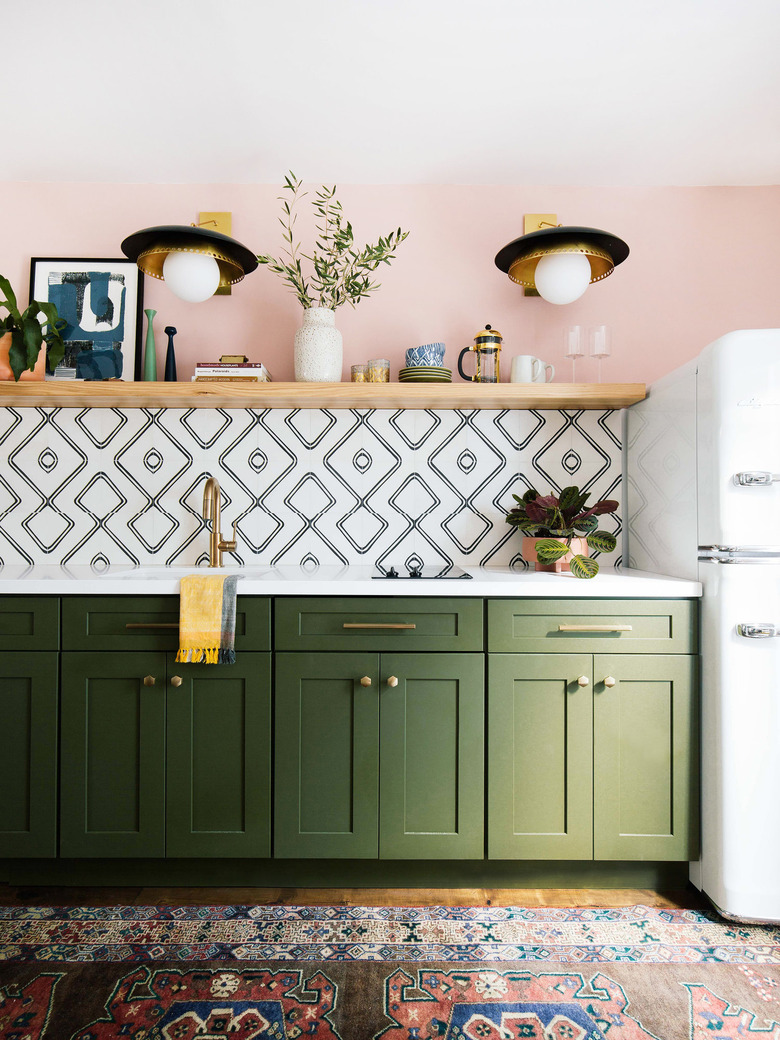 decorative accessories on floating shelf in kitchen