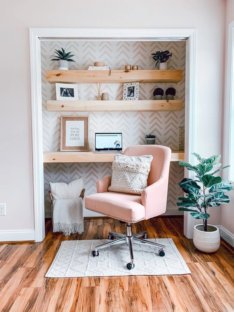 white and pink closet office with chevron wallpaper and pink office chair