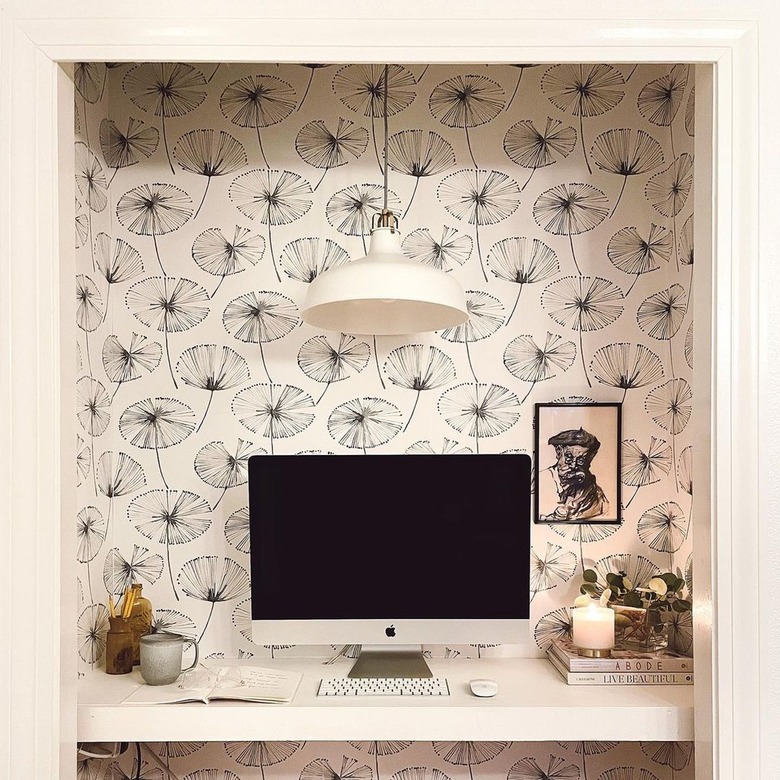 white closet office with white and black wallpaper