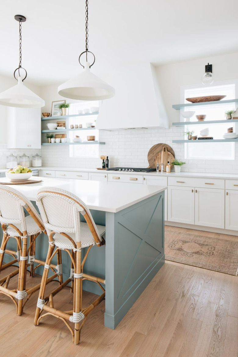 White subway tile coastal backsplash in green and white kitchen