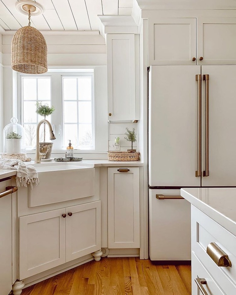 white kitchen with hardwood floor