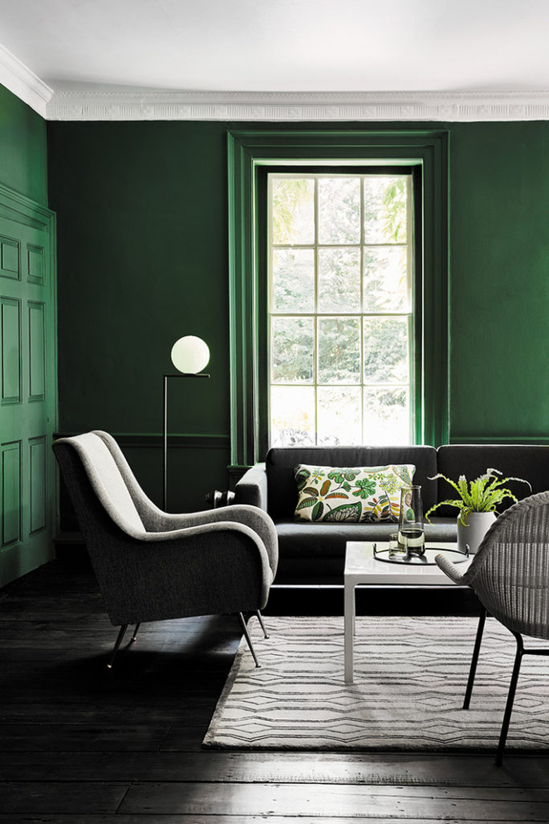 color meaning in green paneled living room with modern furniture