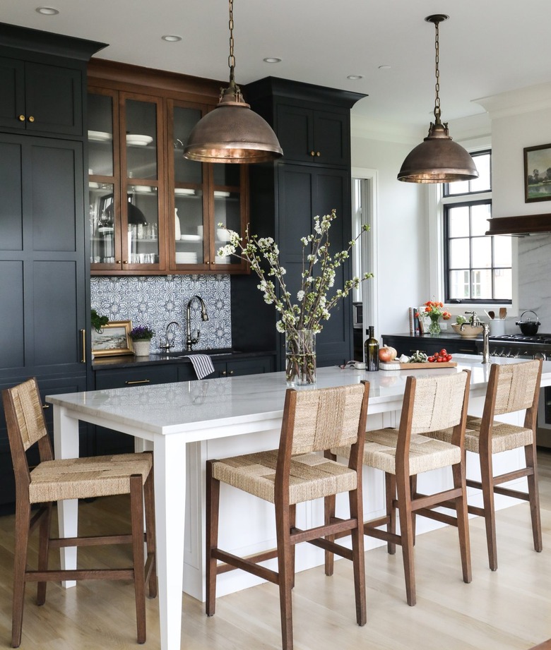 Traditional kitchen with black cabinets and patterned tile