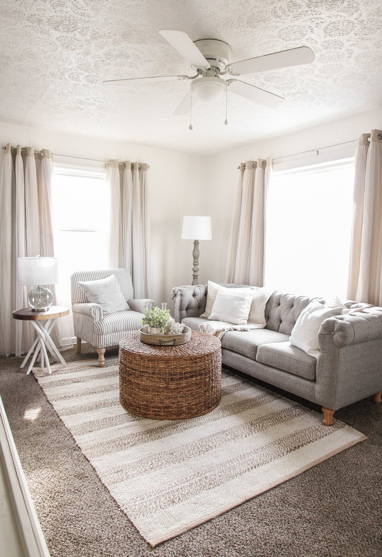 Living room with brown carpet and beige walls