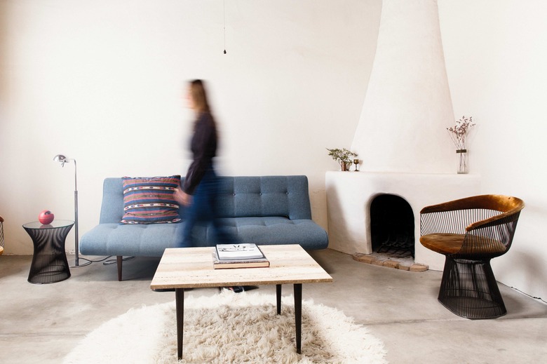 Vintage and modern accent the adobe walls in the living room.