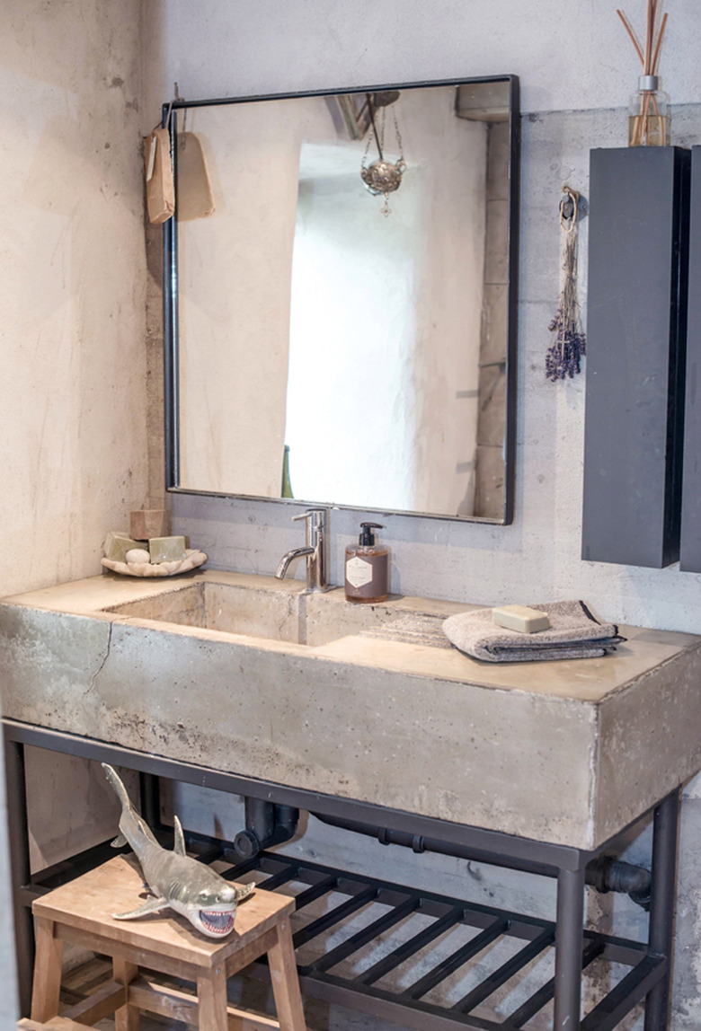 bathroom with concrete countertop