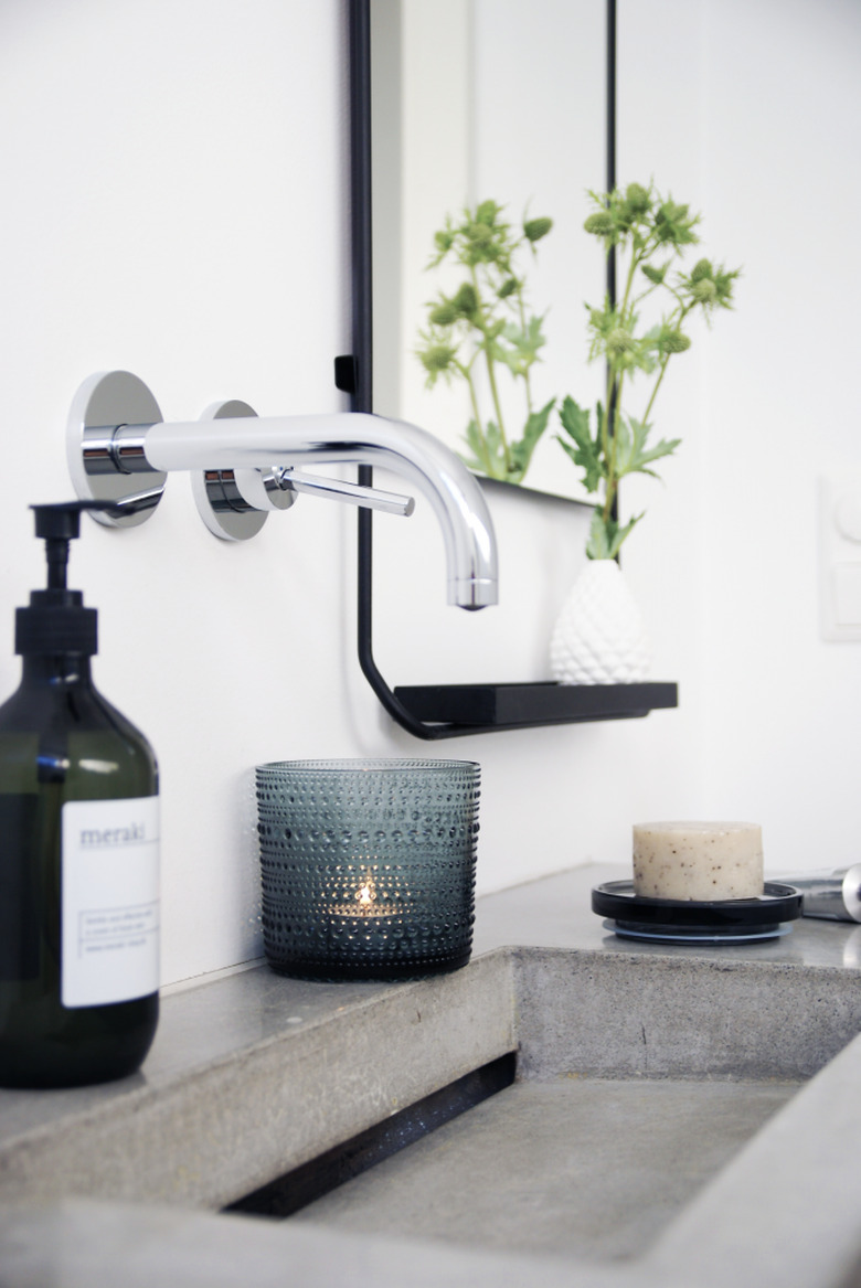 bathroom with concrete countertop and integrated sink