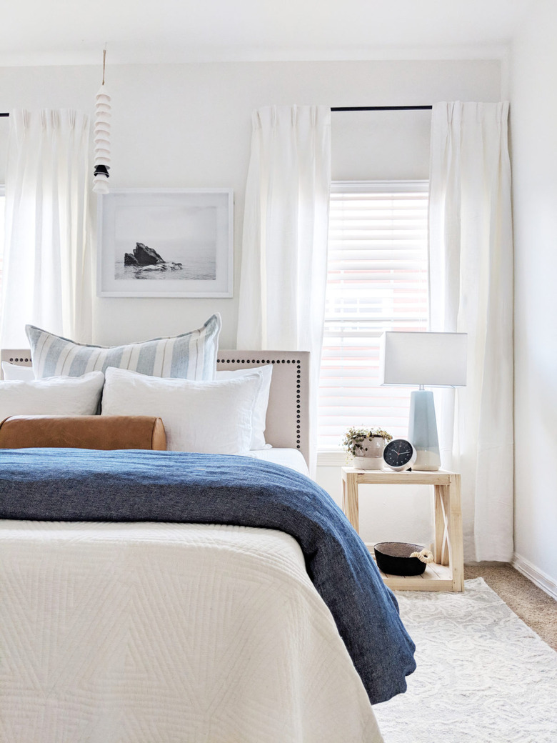 A bright bedroom with blue accents