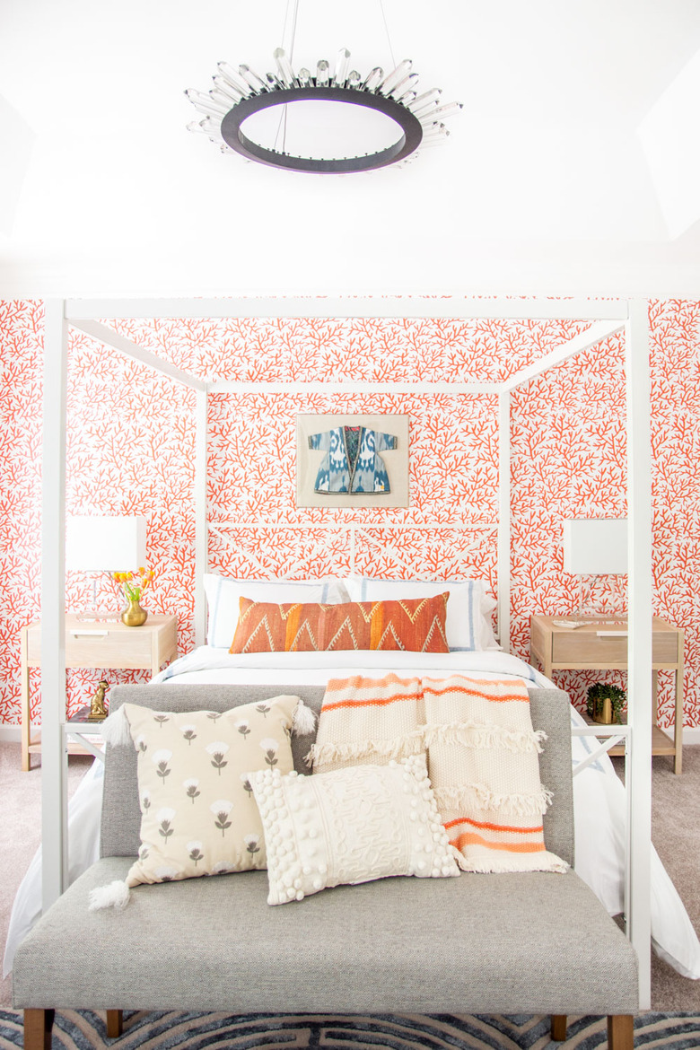 Chandelier above four-poster bed