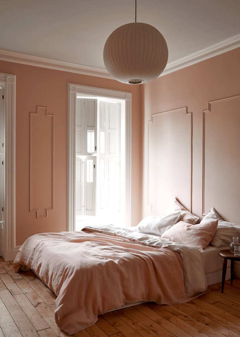 contemporary colors in peach bedroom with circle pendant