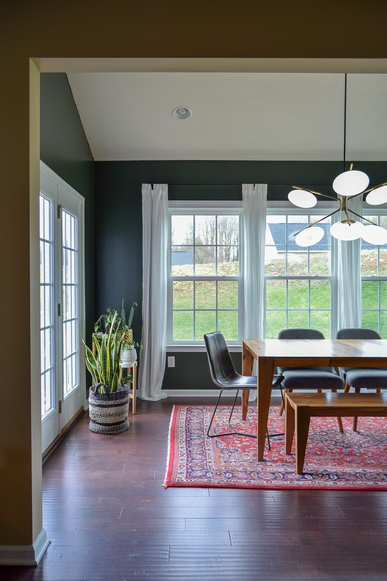 Contemporary dining room lighting idea with futuristic chandelier