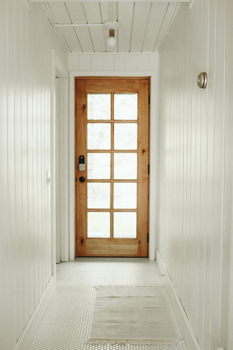 Minimalist Scandinavian-inspired A-frame cabin in the woods Lilla Norr with Contemporary Foyer Lighting