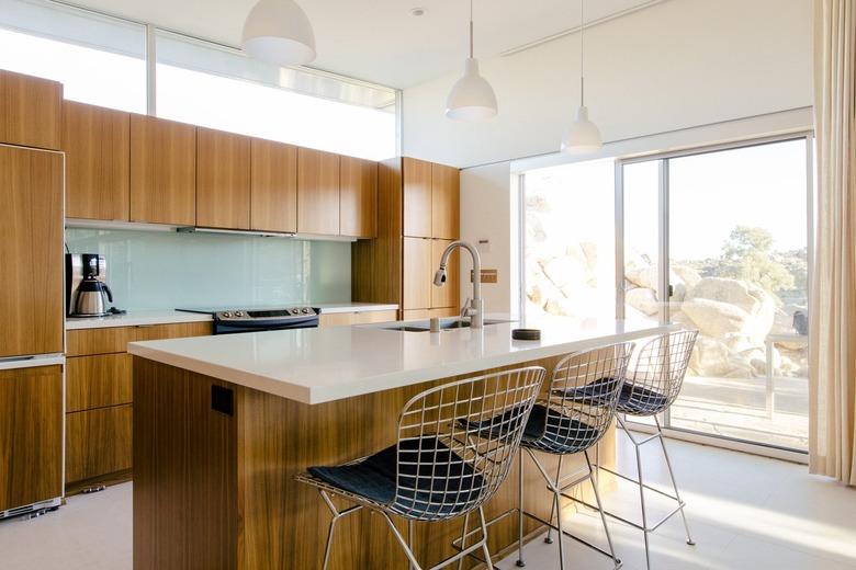 midcentury bar stools with metal mesh seats at a Contemporary Kitchen Island