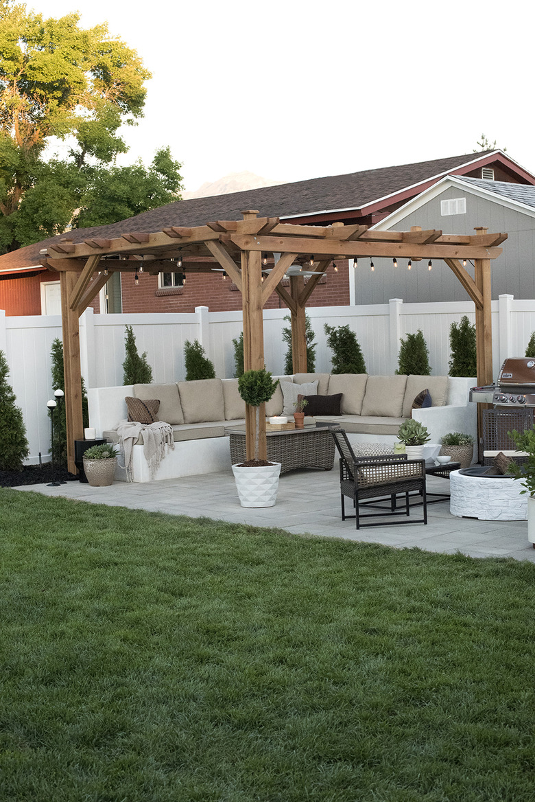 contemporary landscape in garden with pergola and seating