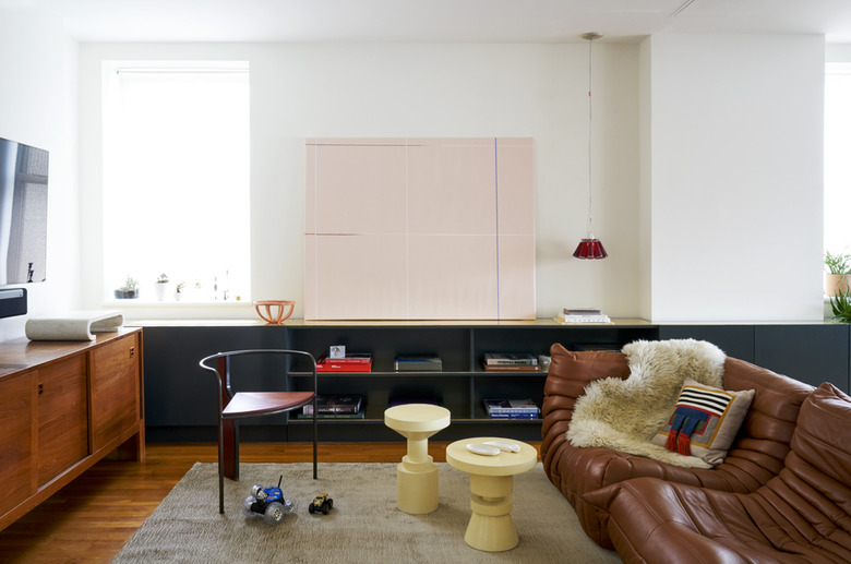 contemporary living room with vintage pieces of furniture