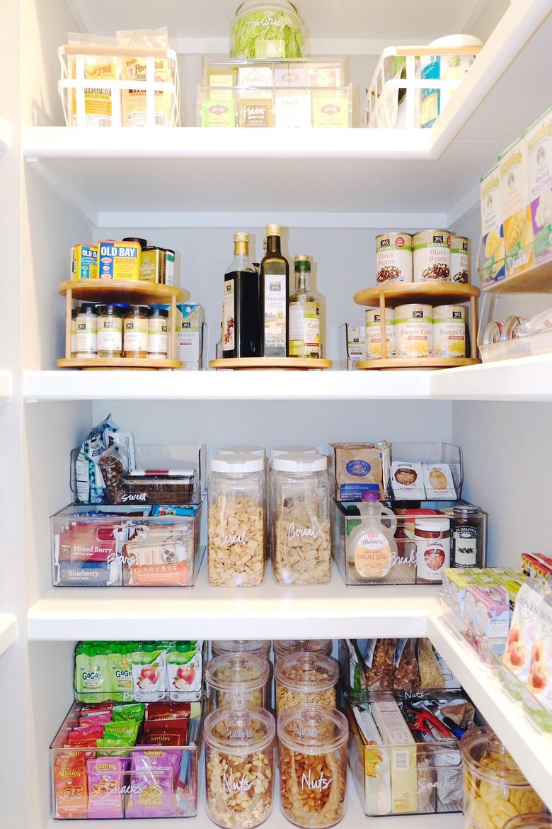 Pantry shelves with various containers.