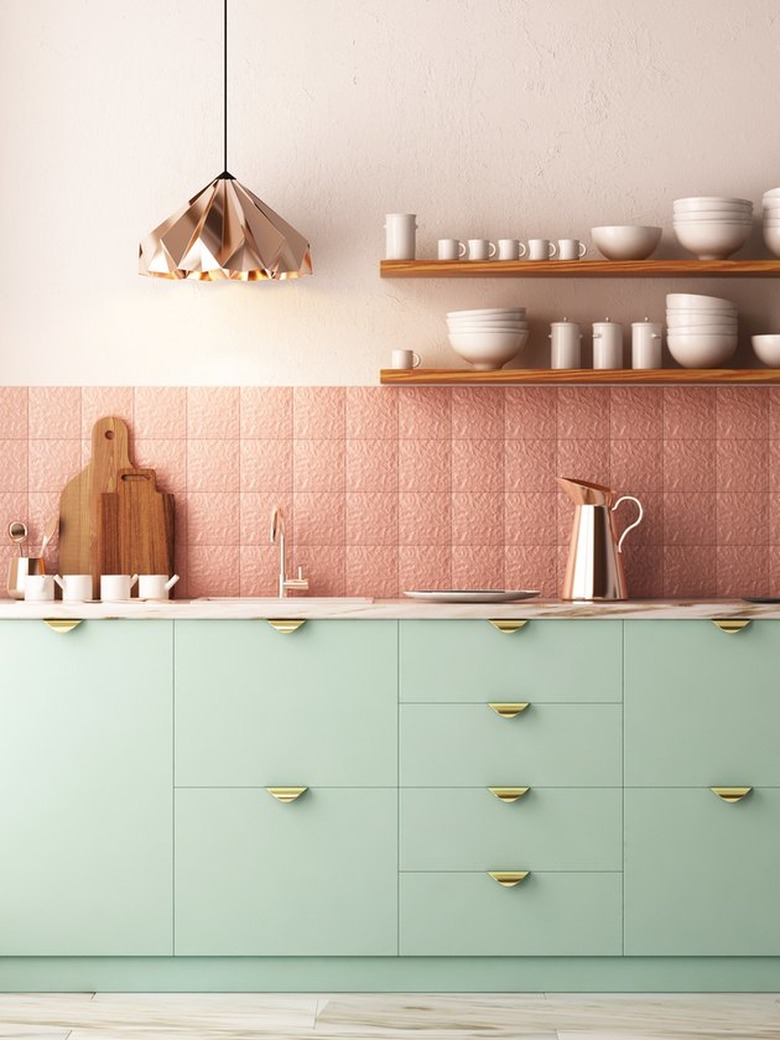 mint green kitchen with copper backsplash and pendant light