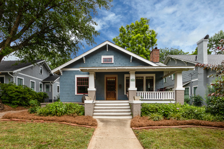 craftsman house with white steps and blue exterior