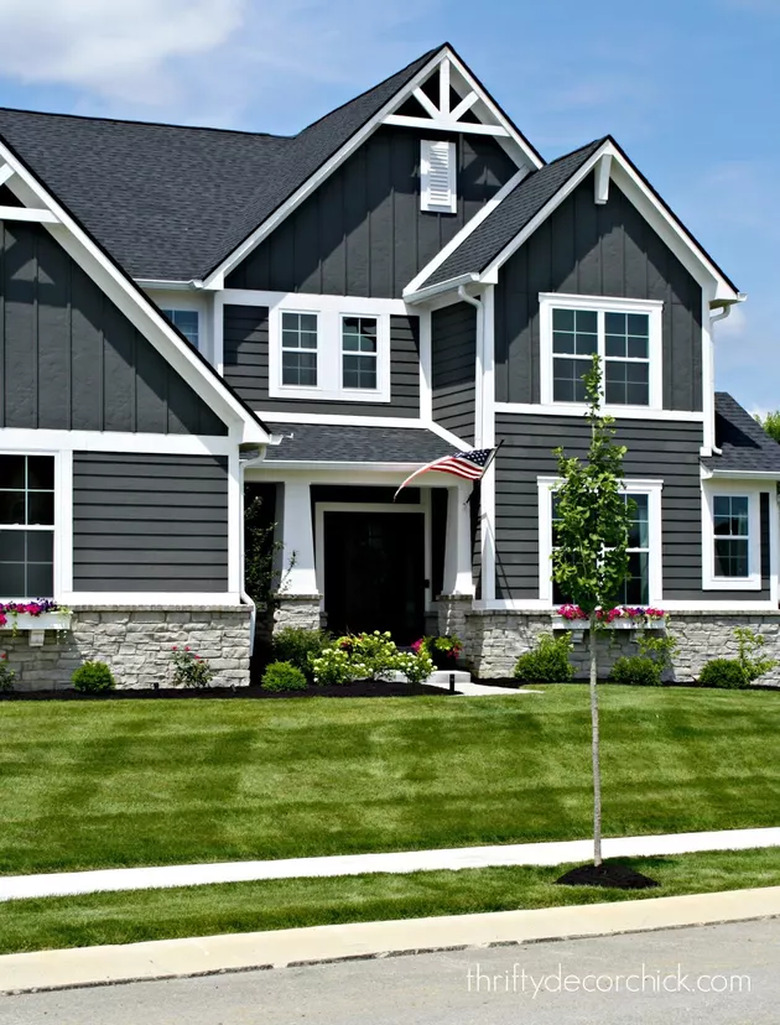 black craftsman house with white trim