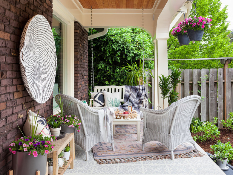 Craftsman front porch with wicker chairs and bohemian decor