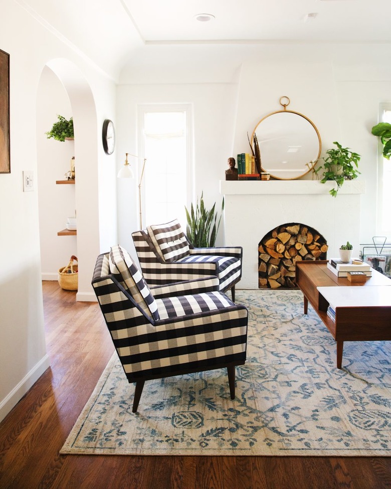 Craftsman living room with white walls and painted white fireplace