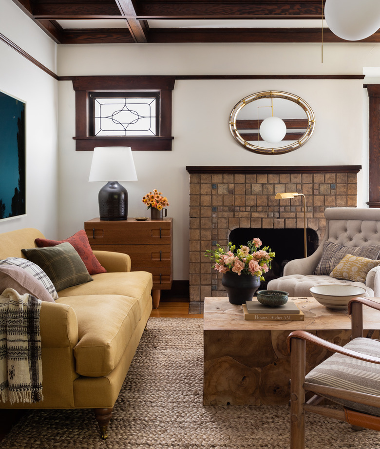 Craftsman living room with brick fireplace and yellow sofa