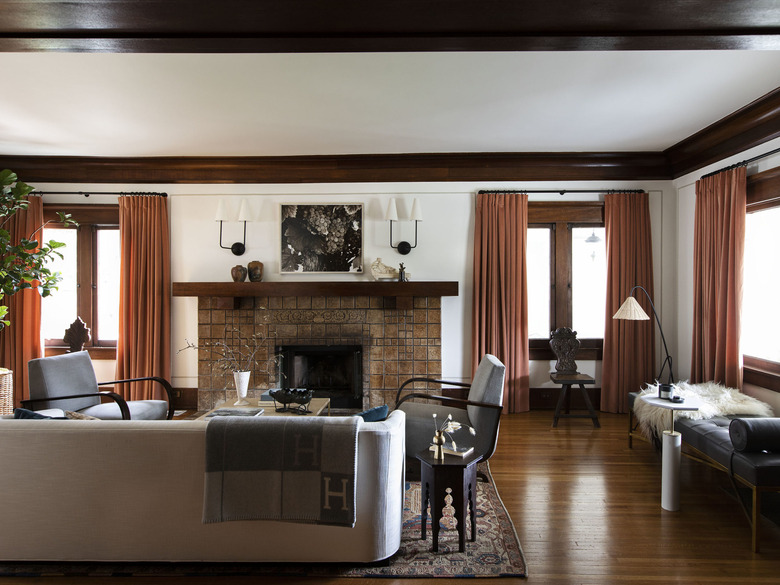 Craftsman living room with stone fireplace and wood floors