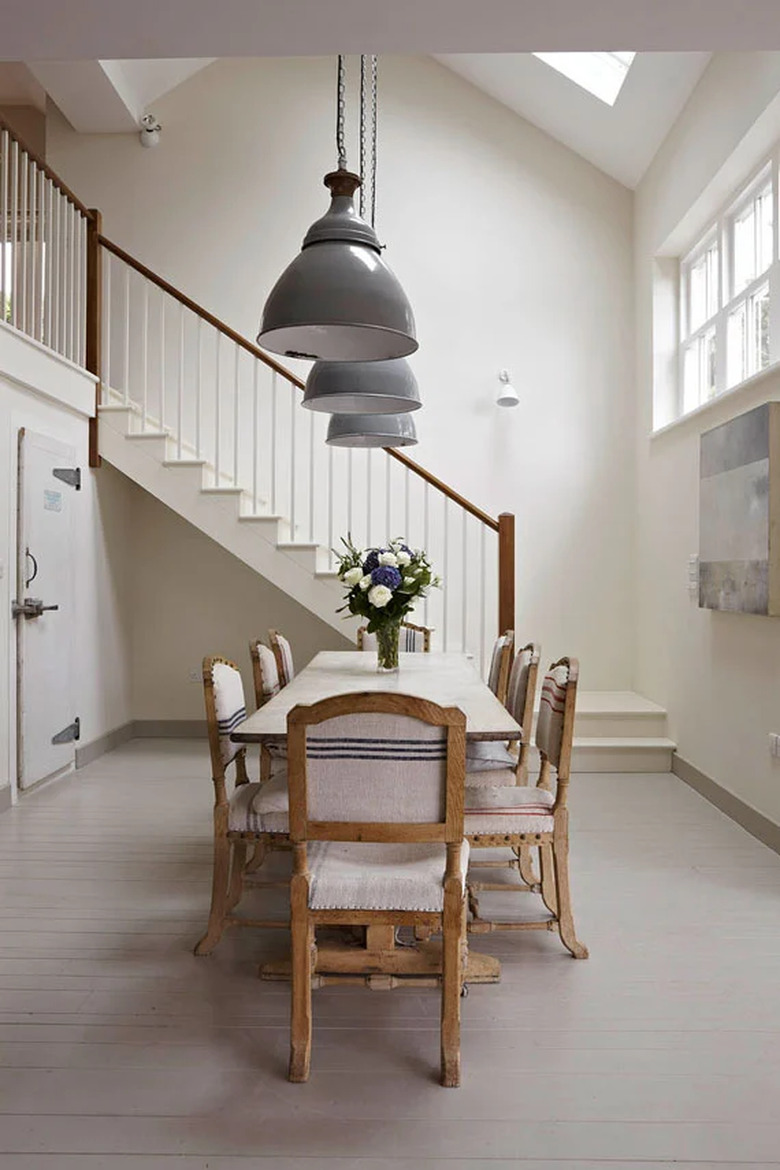 cream color dining room with pendant lights