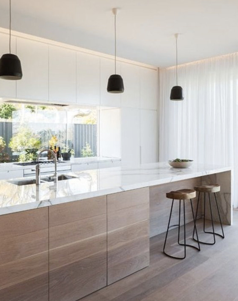 Consider bleaching your kitchen wood floors to match your cabinets.