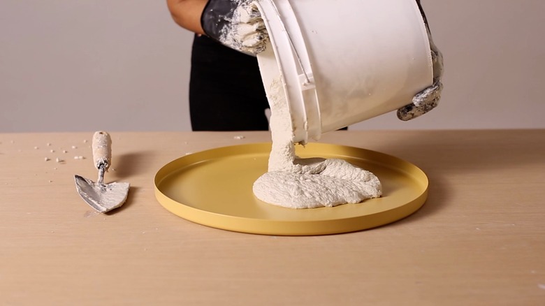 Pouring concrete into GLADOM tray for terrazzo tabletop