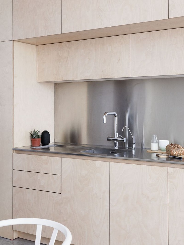 stainless steel kitchen backsplash with wood cabinets