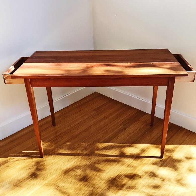 Rectangular table made from a reclaimed carriage house door