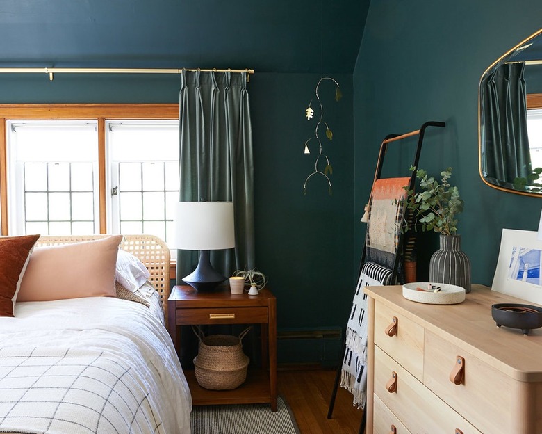 Hunter green curtains in darker green bedroom