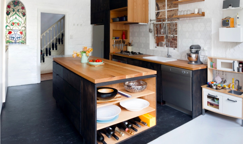 wood countertops with stained glass and dark vinyl kitchen floors