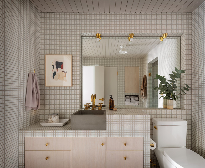 porcelain tile bathroom with concrete sink and deck mounted faucet