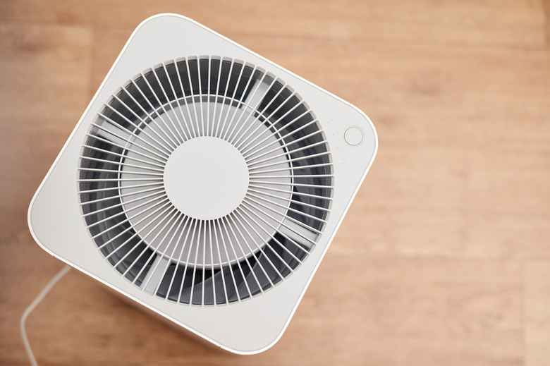 White air purifier in an apartment. Close-up, selective focus