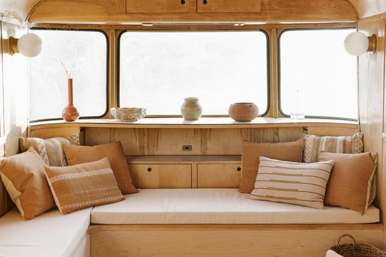 seating area in neutral palette with pillows and decor items