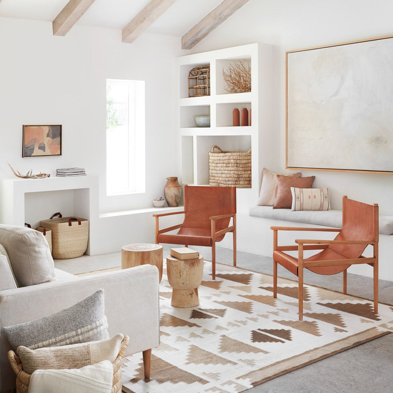 desert modern living room with leather chairs and woven baskets