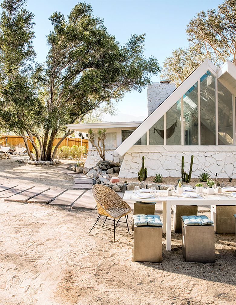 Desert style home in the A-frame style with white exposed stonework