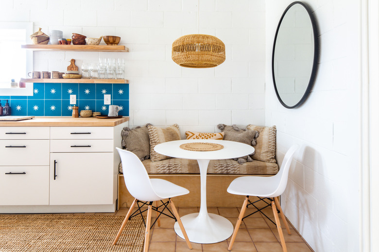 Desert-Themed Kitchen with blue backsplash and wood countertop