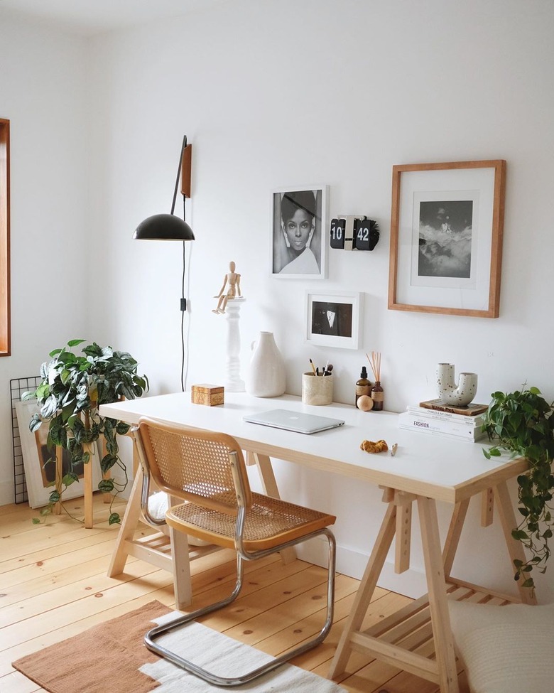 work space with gallery wall and lamp